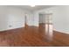 Bright living room featuring gleaming hardwood floors, white trim, and seamless transitions to adjoining rooms at 790 Denards Se Ml, Marietta, GA 30067