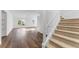 Sunlit living room featuring hardwood floors and staircase at 790 Denards Se Ml, Marietta, GA 30067