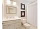 Neutral bathroom features modern vanity with white countertop, framed mirror, and shower-tub combo at 1950 Buford Dam Rd # 105, Cumming, GA 30041