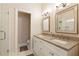Bright, neutral bathroom with double sinks, quartz counters, updated fixtures, and glass shower at 1950 Buford Dam Rd # 105, Cumming, GA 30041