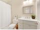 Well-lit bathroom offers a bright vanity with modern fixtures and a shower-tub combo at 1950 Buford Dam Rd # 105, Cumming, GA 30041