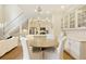 Dining room featuring a stylish chandelier, hardwood floors, and access to the kitchen at 1950 Buford Dam Rd # 105, Cumming, GA 30041