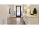 Elegant entryway featuring a decorative glass door, light-toned walls, and hardwood flooring at 1950 Buford Dam Rd # 105, Cumming, GA 30041