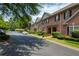 Brick townhome row with neat landscaping along the street at 1950 Buford Dam Rd # 105, Cumming, GA 30041