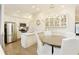 Eat-in kitchen with an island, stainless appliances, hardwood floors, and granite countertops at 1950 Buford Dam Rd # 105, Cumming, GA 30041