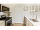 Updated kitchen features stainless steel appliances, and stylish granite countertops at 1950 Buford Dam Rd # 105, Cumming, GA 30041