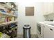 Laundry room featuring shelving, modern washer and dryer, and a trash receptacle at 1950 Buford Dam Rd # 105, Cumming, GA 30041