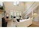 Spacious living room featuring high ceilings, a fireplace, and access to a charming balcony at 1950 Buford Dam Rd # 105, Cumming, GA 30041