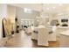 Bright, open living room with soaring ceilings, a chandelier, and seamless flow to the kitchen at 1950 Buford Dam Rd # 105, Cumming, GA 30041
