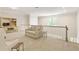Relaxing loft area with comfortable sofa, desk, and cozy seating for versatile space at 1950 Buford Dam Rd # 105, Cumming, GA 30041