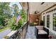 Comfortable patio offers scenic views with wrought iron railings and comfortable patio furniture at 1950 Buford Dam Rd # 105, Cumming, GA 30041