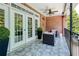 Charming patio features brick wall, ceiling fan, tiled flooring, and ample outdoor seating at 1950 Buford Dam Rd # 105, Cumming, GA 30041