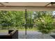 Relaxing patio with black metal railings and lovely wooded backyard views at 1950 Buford Dam Rd # 105, Cumming, GA 30041