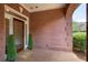 Brick porch with decorative glass door, potted plants and patterned brickwork at 1950 Buford Dam Rd # 105, Cumming, GA 30041