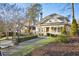 Charming home with a brick walkway, manicured lawn, and inviting front porch, showcasing curb appeal at 126 Ridgeland Ne Way, Atlanta, GA 30305