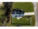 Aerial view of a well-maintained home with a lush green lawn and a fenced backyard at 8007 Wishaw Ct, Winston, GA 30187