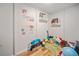 Basement playroom with playful decor and laminate wood floors, perfect for children at 8007 Wishaw Ct, Winston, GA 30187