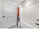 Bright bathroom features a shower with a colorful curtain and a tiled floor at 8007 Wishaw Ct, Winston, GA 30187