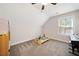 Inviting bedroom with a plush carpet, natural light, and a fun play area at 8007 Wishaw Ct, Winston, GA 30187