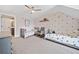 Charming bedroom featuring two twin beds, soft carpet, and playful decor at 8007 Wishaw Ct, Winston, GA 30187