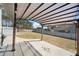 Spacious patio with a pergola, perfect for outdoor entertaining in fenced backyard at 8007 Wishaw Ct, Winston, GA 30187