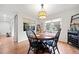 Well-lit dining area featuring a round table with seating for four and a modern light fixture at 14 Hampshire Ct, Avondale Estates, GA 30002