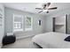 Bright bedroom features plush carpet, a ceiling fan, and large windows at 257 Birch St, Atlanta, GA 30354