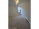 A bright bedroom awaits its new flooring, featuring a window to outside at 110 Jackson St, Buford, GA 30518