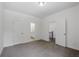 Spacious bedroom boasts neutral carpet, white walls, and easy access to both closet and bathroom at 110 Jackson St, Buford, GA 30518