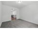 Neutral bonus room with plush gray carpet and access to the hallway and stairs at 110 Jackson St, Buford, GA 30518