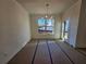 Dining room features lots of natural light, door to the deck, and decorative chandelier at 110 Jackson St, Buford, GA 30518