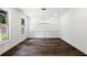 Bright dining room with wainscotting detail, hardwood floors, and natural light at 110 Jackson St, Buford, GA 30518