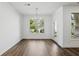 Dining room with wood flooring, natural light, and decorative light fixture at 110 Jackson St, Buford, GA 30518