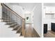 Foyer featuring hardwood floors, craftsman style staircase and white walls at 110 Jackson St, Buford, GA 30518