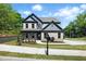 Charming two-story home with brick exterior, landscaped front yard, and welcoming curb appeal at 110 Jackson St, Buford, GA 30518