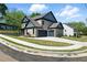 View of the exterior of the house, featuring a two car attached garage at 110 Jackson St, Buford, GA 30518
