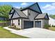 Two-car attached garage on a large, well-manicured lawn at 110 Jackson St, Buford, GA 30518