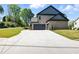 Long driveway leading to a two-car attached garage at 110 Jackson St, Buford, GA 30518