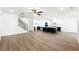 Open concept kitchen and living space with large island, hardwood floors and lots of light at 110 Jackson St, Buford, GA 30518