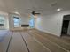 Spacious living room featuring an electric fireplace, ceiling fan and lots of light at 110 Jackson St, Buford, GA 30518