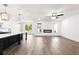 Open living space with hardwood floors, modern fireplace and lots of natural light at 110 Jackson St, Buford, GA 30518