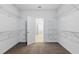 Spacious walk-in closet featuring wire shelving and neutral carpet, providing ample storage solutions at 110 Jackson St, Buford, GA 30518