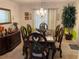 Formal dining room featuring chandelier, accent wall, wooden table and carved chairs at 2270 Exchange Se Pl, Conyers, GA 30013