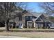 Charming brick two-story home with double front doors and manicured landscaping at 2270 Exchange Se Pl, Conyers, GA 30013