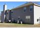 View of the backyard and rear exterior featuring neutral siding and outdoor seating at 2270 Exchange Se Pl, Conyers, GA 30013