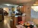 Open kitchen with stainless steel appliances, wood cabinets, an island and chandelier at 2270 Exchange Se Pl, Conyers, GA 30013