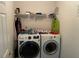 This laundry room includes modern washer and dryer appliances at 2270 Exchange Se Pl, Conyers, GA 30013