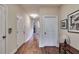 Hallway with hardwood floors, white trim and doors, and recessed lighting at 2406 St Davids Sq, Kennesaw, GA 30152