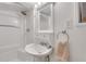 Bathroom features a white sink, mirror, and towel rack at 834 Kipling Nw Dr, Atlanta, GA 30318