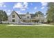 A manicured backyard boasts a modern in-ground pool and lounge area that provides a tranquil oasis for relaxation and enjoyment at 1297 Swims Valley Nw Dr, Atlanta, GA 30327